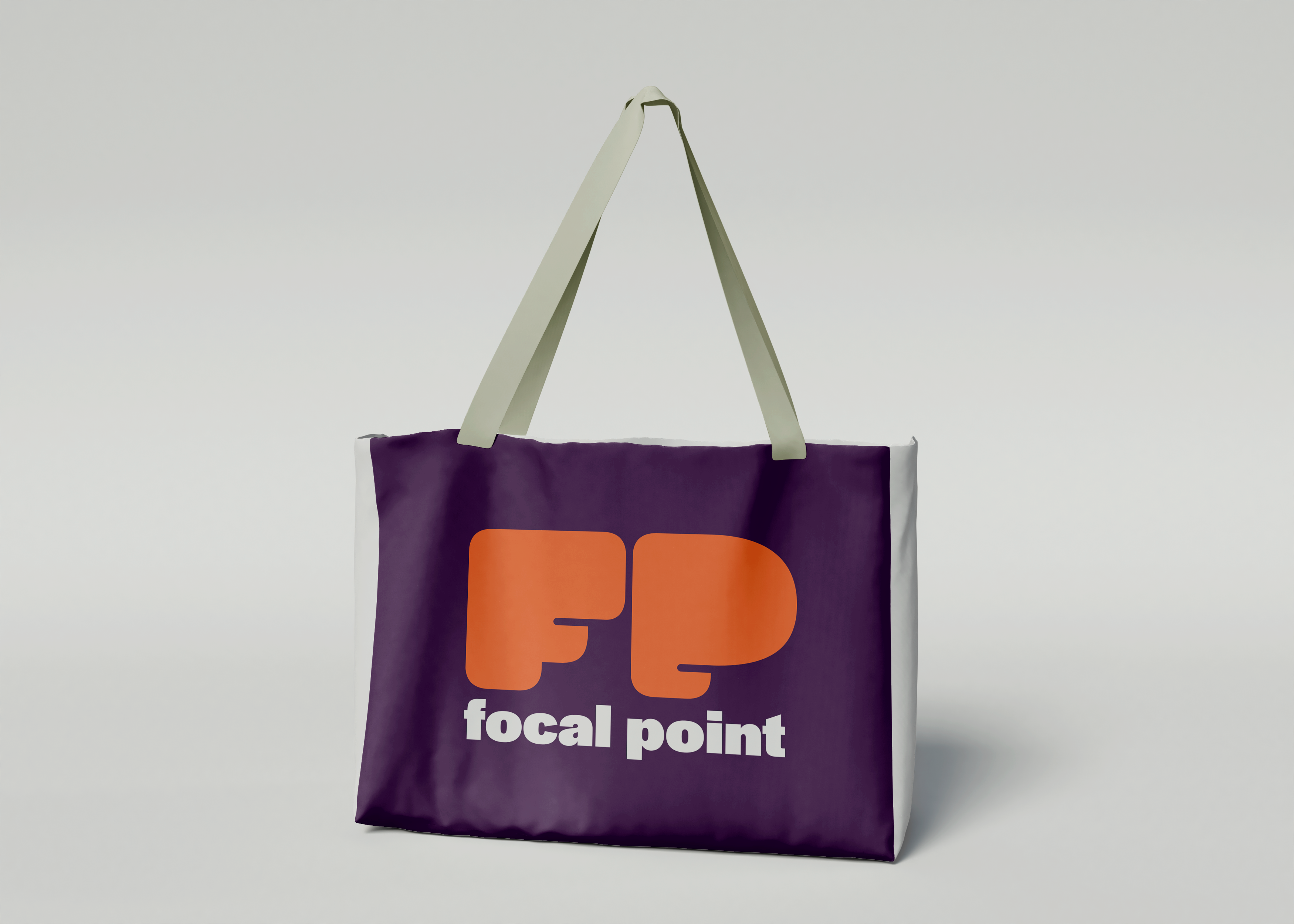 mockup-totebag-update Purple totebag with the Focal Point logo on it